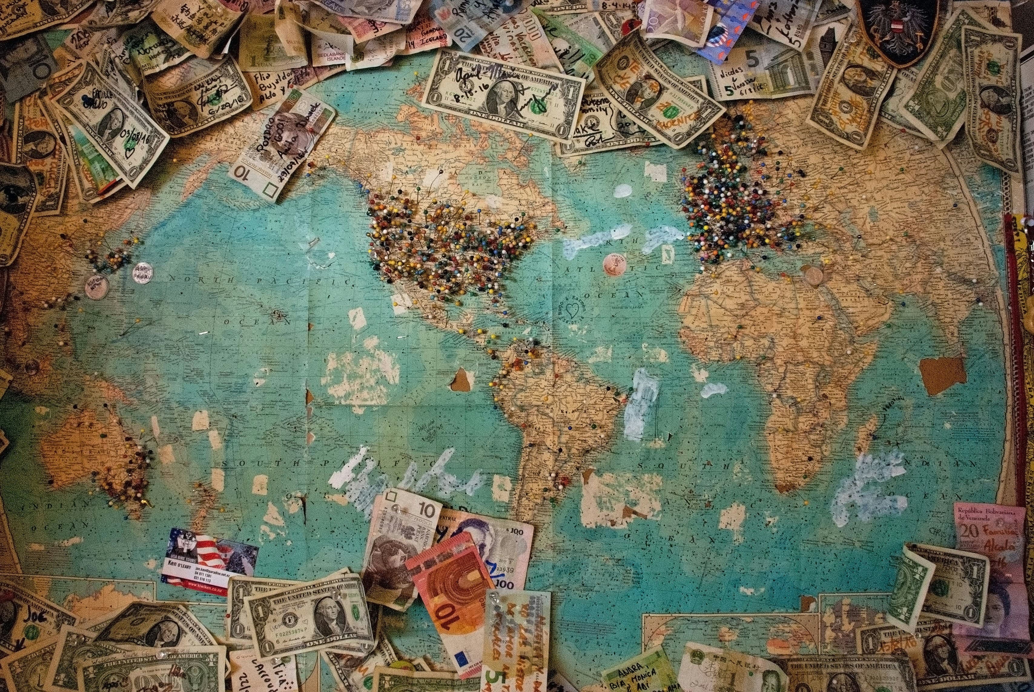 Image of a world map with dollar lying on it